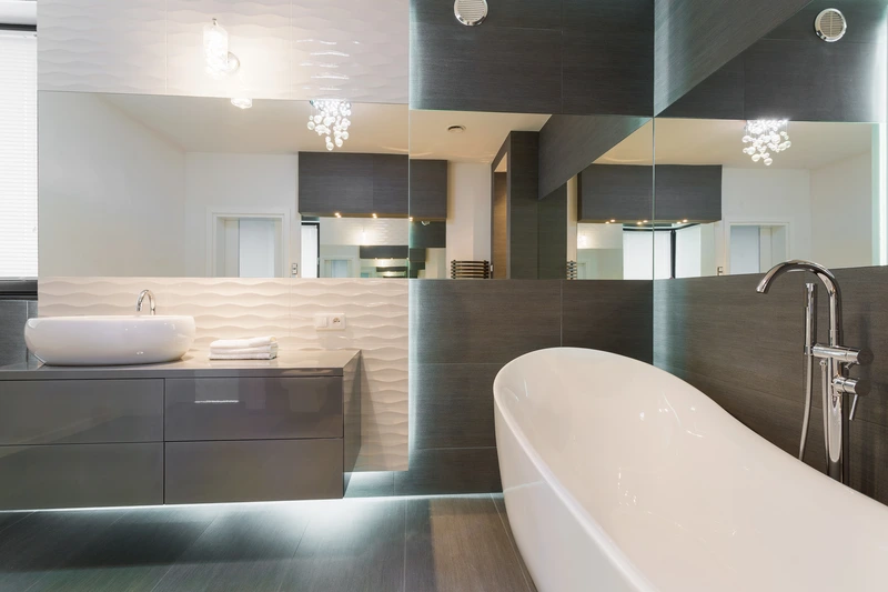 Modern dark bathroom renovation in Tempe featuring spa-inspired design and craftsmanship